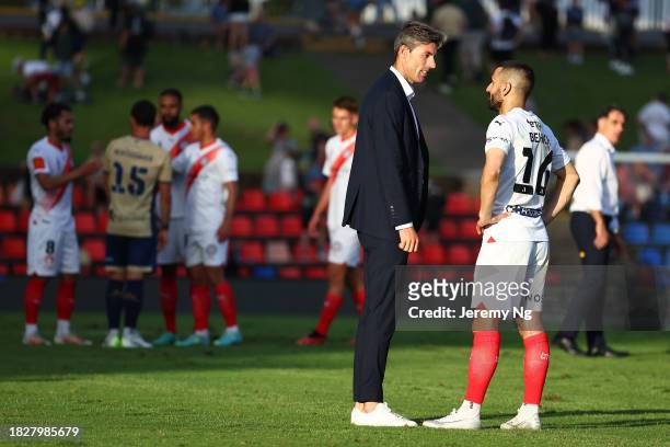 Former Jets player Jason Hoffman speaks to Aziz Behich of Melbourne City after the A-League Men round six match between Newcastle Jets and Melbourne...