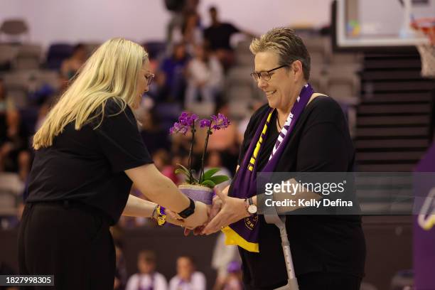 Linda Geheran receives the 40th anniversary presentation on behalf of her mum Jan Collinson during the WNBL match between Melbourne Boomers and Perth...