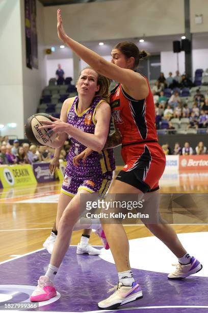 Keely Froling of the Boomers drives to the basket during the WNBL match between Melbourne Boomers and Perth Lynx at Melbourne Sports Centres -...