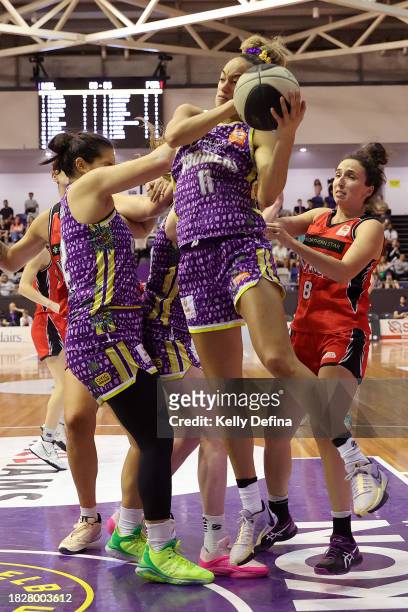 Tera Reed of the Boomers takes a rebound during the WNBL match between Melbourne Boomers and Perth Lynx at Melbourne Sports Centres - Parkville, on...