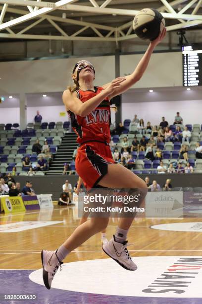 Miela Goodchild of the Lynx drives to the basket during the WNBL match between Melbourne Boomers and Perth Lynx at Melbourne Sports Centres -...