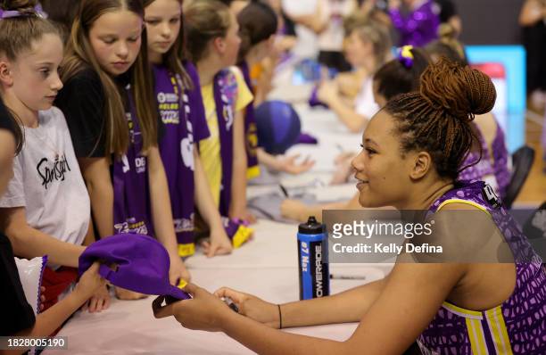 Naz Hillmon of the Boomers signs autographs for fans during the WNBL match between Melbourne Boomers and Perth Lynx at Melbourne Sports Centres -...