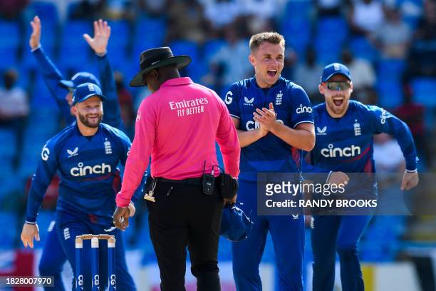 Sam Curran of England celebrates the dismissal of Shimron Hetmyer of West Indies during the 2nd ODI match between West Indies and England at Vivian...
