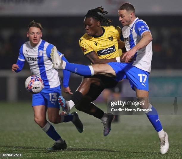 Razzaq Coleman De-Graft of Maidstone United and James Chester of Barrow during the Emirates FA Cup Second Round match between Maidstone United and...