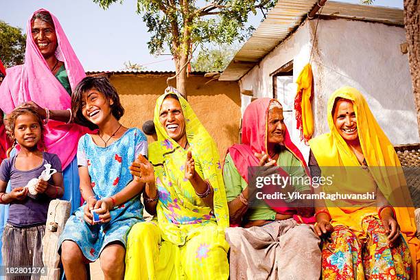 cheerful traditional rural indian family of rajasthan - dorp stockfoto's en -beelden