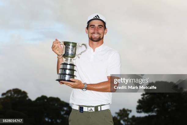 Joaquin Niemann of Chile poses with the Stonehaven Cup after winning the Men's ISPS HANDA Australian Open on the 18th green following the ISPS HANDA...