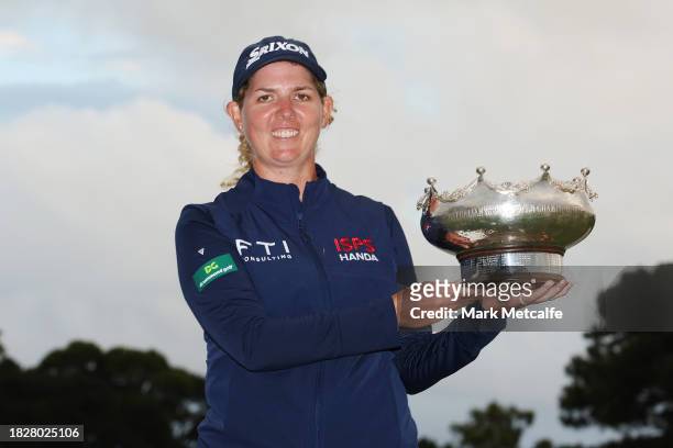 Ashleigh Buhai of South Africa poses with the Patricia Bridges Bowl after winning the Women's ISPS HANDA Australian Open for a back to back time on...