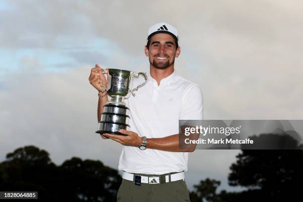 Joaquin Niemann of Chile poses with the Stonehaven Cup after winning the Men's ISPS HANDA Australian Open on the 18th green following the ISPS HANDA...
