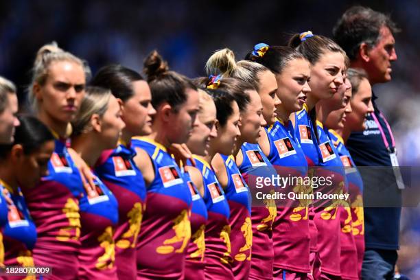 The Lions stand for the national anthem during the AFLW Grand Final match between North Melbourne Tasmania Kangaroos and Brisbane Lions at Ikon Park,...