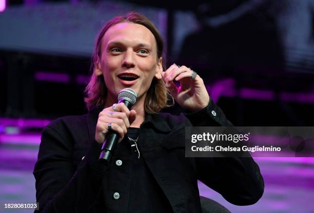 Jamie Campbell Bower speaks during the Spotlight on: Jamie Campbell Bower panel at Los Angeles Comic Con at Los Angeles Convention Center on December...