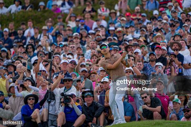 Min Woo Lee of Australia plays his chip shot on to the 18th green during the ISPS HANDA Australian Open at The Australian Golf Course on December 03,...