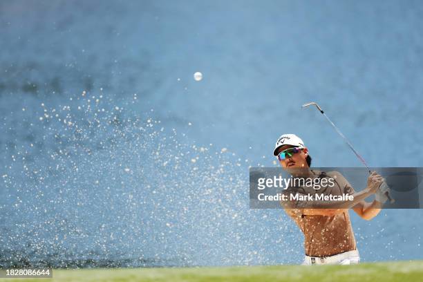 Min Woo Lee of Australia plays a shot from the bunker on the th hole during the ISPS HANDA Australian Open at The Australian Golf Course on December...