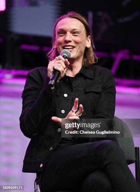 Jamie Campbell Bower speaks during the Spotlight on: Jamie Campbell Bower panel at Los Angeles Comic Con at Los Angeles Convention Center on December...