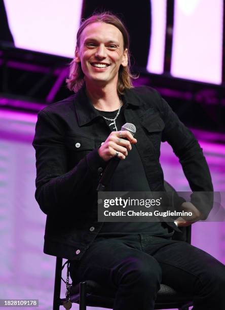 Jamie Campbell Bower speaks during the Spotlight on: Jamie Campbell Bower panel at Los Angeles Comic Con at Los Angeles Convention Center on December...