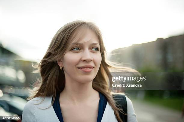 young girl walking against a blurred background - portrait blurred background stockfoto's en -beelden