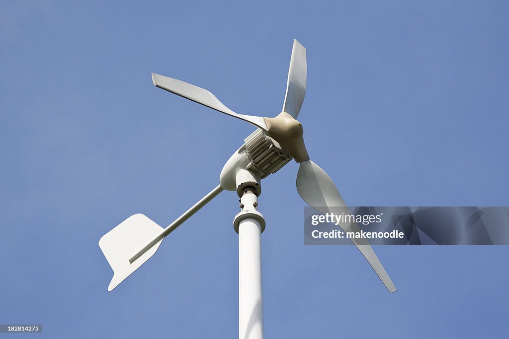 Small Wind Turbine Against Blue Sky