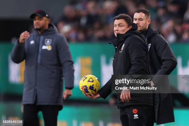 Paul Heckingbottom, Manager of Sheffield United, holds the match ball during the Premier League match between Burnley FC and Sheffield United at Turf...