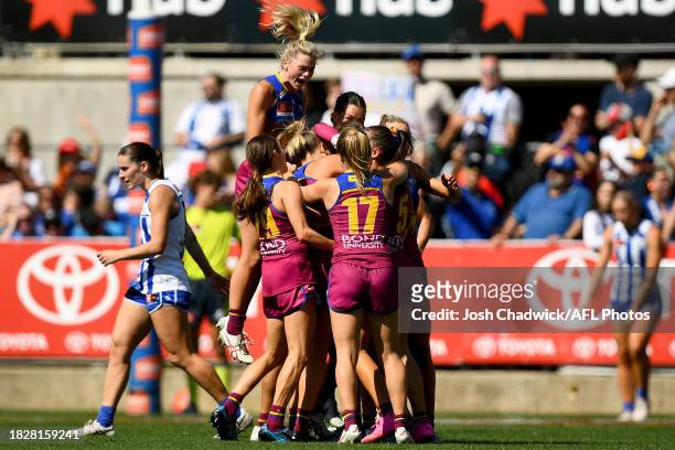 The Lions celebrate after kicking a goal during the AFLW Grand Final match between North Melbourne Tasmania Kangaroos and Brisbane Lions at Ikon...