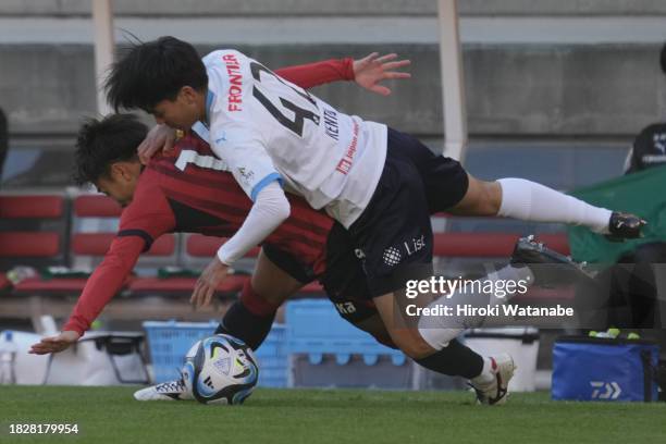 Yuta Higuchi of Kashima Antlers and Kento Hashimoto of Yokohama FC compete for the ball during the J.LEAGUE Meiji Yasuda J1 34th Sec. Match between...