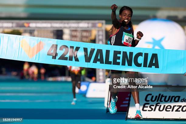 Worknesh Debele Degefa of Ethipioa arrives to the finish line for win the 2023 Valencia Marathon Trinidad Alfonso on December 03, 2023 in Valencia,...
