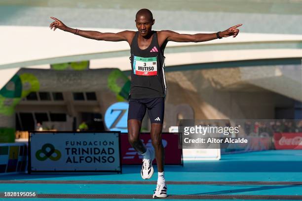 Alexander Mutiso of Kenya arrives to the finish line of the 2023 Valencia Marathon Trinidad Alfonso on December 03, 2023 in Valencia, Spain.