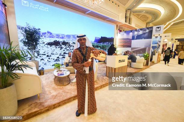 Man greets guests with Arabic coffee at the Red Sea International Film Festival 2023 on December 03, 2023 in Jeddah, Saudi Arabia.