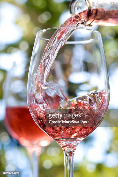 red rose wine alfresco in glasses - rose wine stock pictures, royalty-free photos & images