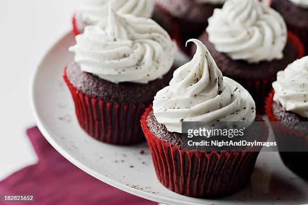 red velvet cupcakes - icing stock pictures, royalty-free photos & images