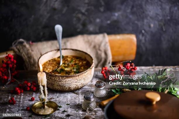 cabbage soup in a ceramic bowl on a wooden old table - stuffed cabbage stock pictures, royalty-free photos & images