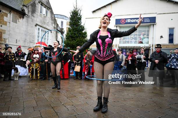 Participants dress up in Christmas themed Steampunk attire as they take part in a procession through the town centre, on December 03, 2023 in...