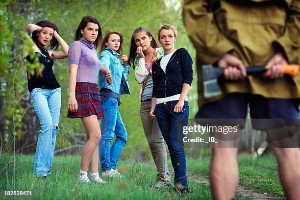 five girls saw in the woods maniac with an axe - axe murderer stock pictures, royalty-free photos & images