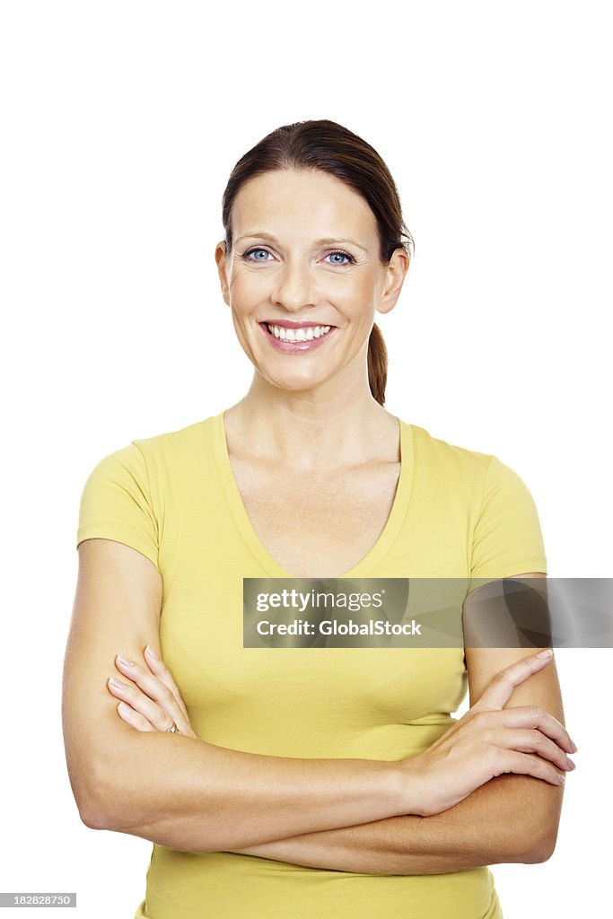 Smiling mature female with arms crossed against white