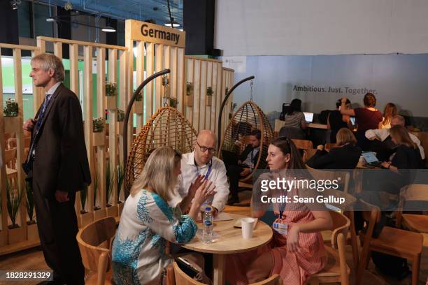 Participants confer in the Germany pavilion on day four of the UNFCCC COP28 Climate Conference at Expo City Dubai on December 03, 2023 in Dubai,...