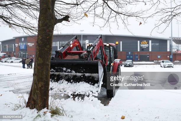Tractor can be seen clearing snow prior to the Emirates FA Cup Second Round match between Chesterfield and Leyton Orient at Technique Stadium on...