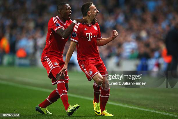 Franck Ribery of Muenchen celebrates scoring the opening goal with David Alaba of Muenchen during the UEFA Champions League Group D match between...