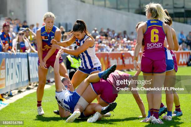 Players wrestle during the AFLW Grand Final match between North Melbourne Tasmania Kangaroos and Brisbane Lions at Ikon Park, on December 03 in...
