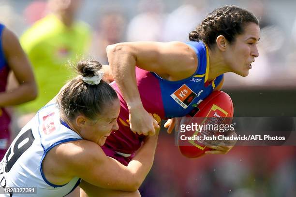 Ally Anderson of the Lions is tackled by Emma Kearney of the Kangaroos during the AFLW Grand Final match between North Melbourne Tasmania Kangaroos...