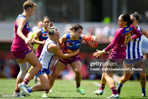 Ally Anderson of the Lions is tackled by Emma Kearney of the Kangaroos during the AFLW Grand Final match between North Melbourne Tasmania Kangaroos...