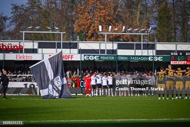 Both teams hold a minute of silence for Agyemang Diawusie, player of Jahn Regensburg who died last week, during the 3. Liga match between SC Verl and...