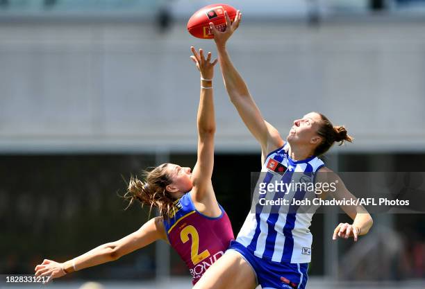 Tahlia Hickie of the Lions and Emma King of the Kangaroos compete in the ruck during the AFLW Grand Final match between North Melbourne Tasmania...