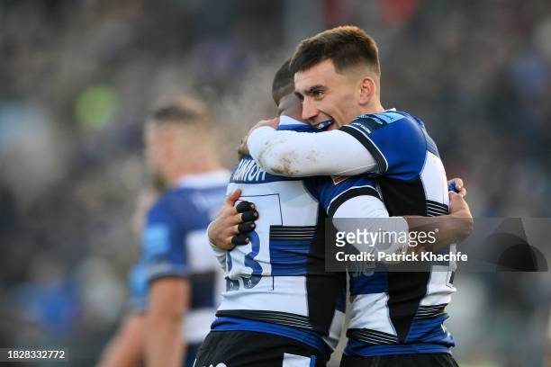 Cameron Redpath of Bath Rugby celebrates scoring the opening try of the match with team-mate Max Ojomoh during the Gallagher Premiership Rugby match...
