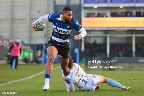 Joe Cokanasiga of Bath Rugby is tackled by Henry Slade of Exeter Chiefs during the Gallagher Premiership Rugby match between Bath Rugby and Exeter...