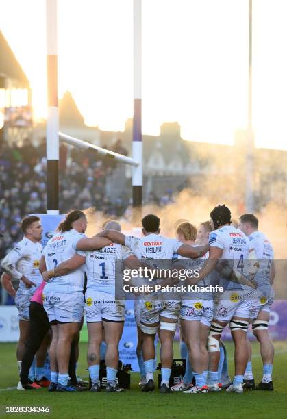 Steam rises from an Exeter Chiefs huddle after they concede a try during the Gallagher Premiership Rugby match between Bath Rugby and Exeter Chiefs...