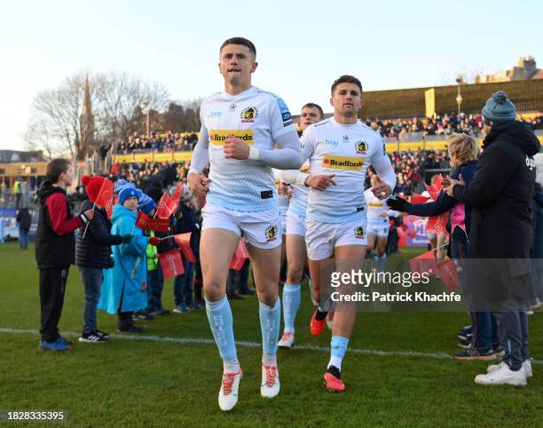 Joe Hawkins and Henry Slade of Exeter Chiefs run onto the field prior to the Gallagher Premiership Rugby match between Bath Rugby and Exeter Chiefs...