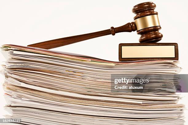 gavel on stack of documents - wetgeving stockfoto's en -beelden