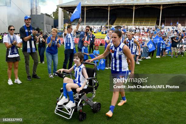 Bella Eddey of the Kangaroos walks onto the field during the AFLW Grand Final match between North Melbourne Tasmania Kangaroos and Brisbane Lions at...