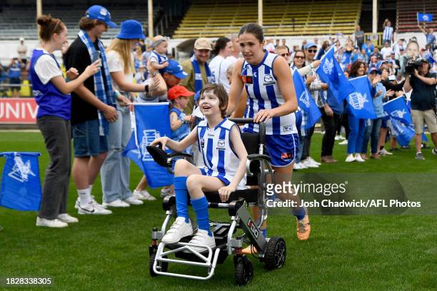 Bella Eddey of the Kangaroos walks onto the field during the AFLW Grand Final match between North Melbourne Tasmania Kangaroos and Brisbane Lions at...