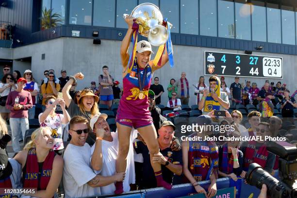 Sophie Conway of the Lions celebrates with the premiership cup after winning the AFLW Grand Final match between North Melbourne Tasmania Kangaroos...