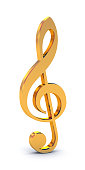 Shiny, golden treble clef free-standing symbol on white