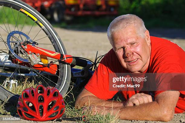 injured senior after bike crash - head wound stock pictures, royalty-free photos & images
